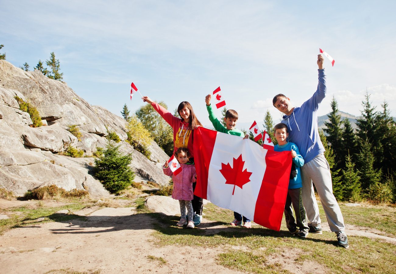 A family holding the Canadian flag