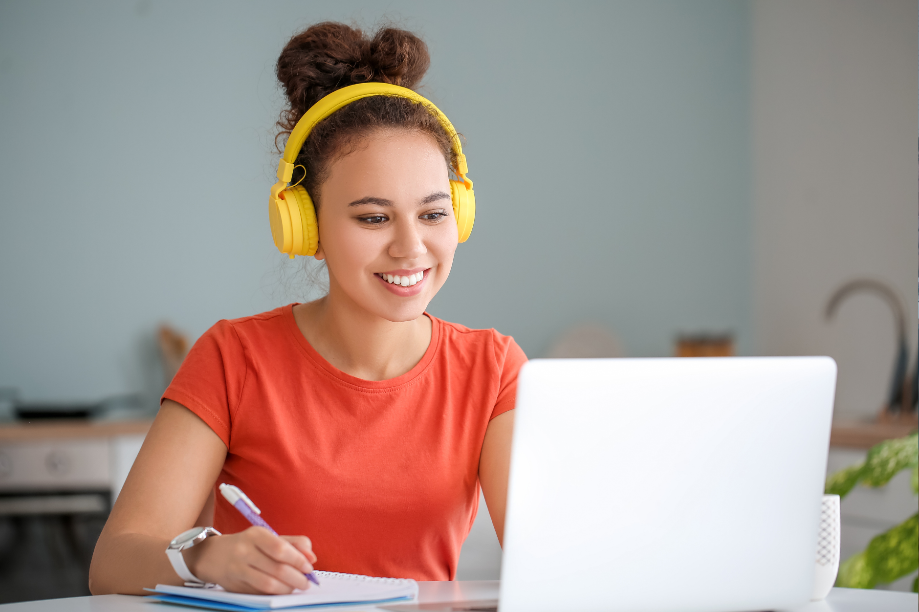 Girl sat at computer during online class