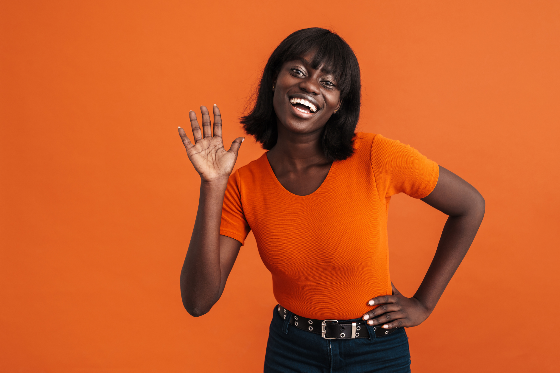 Woman waving and smiling