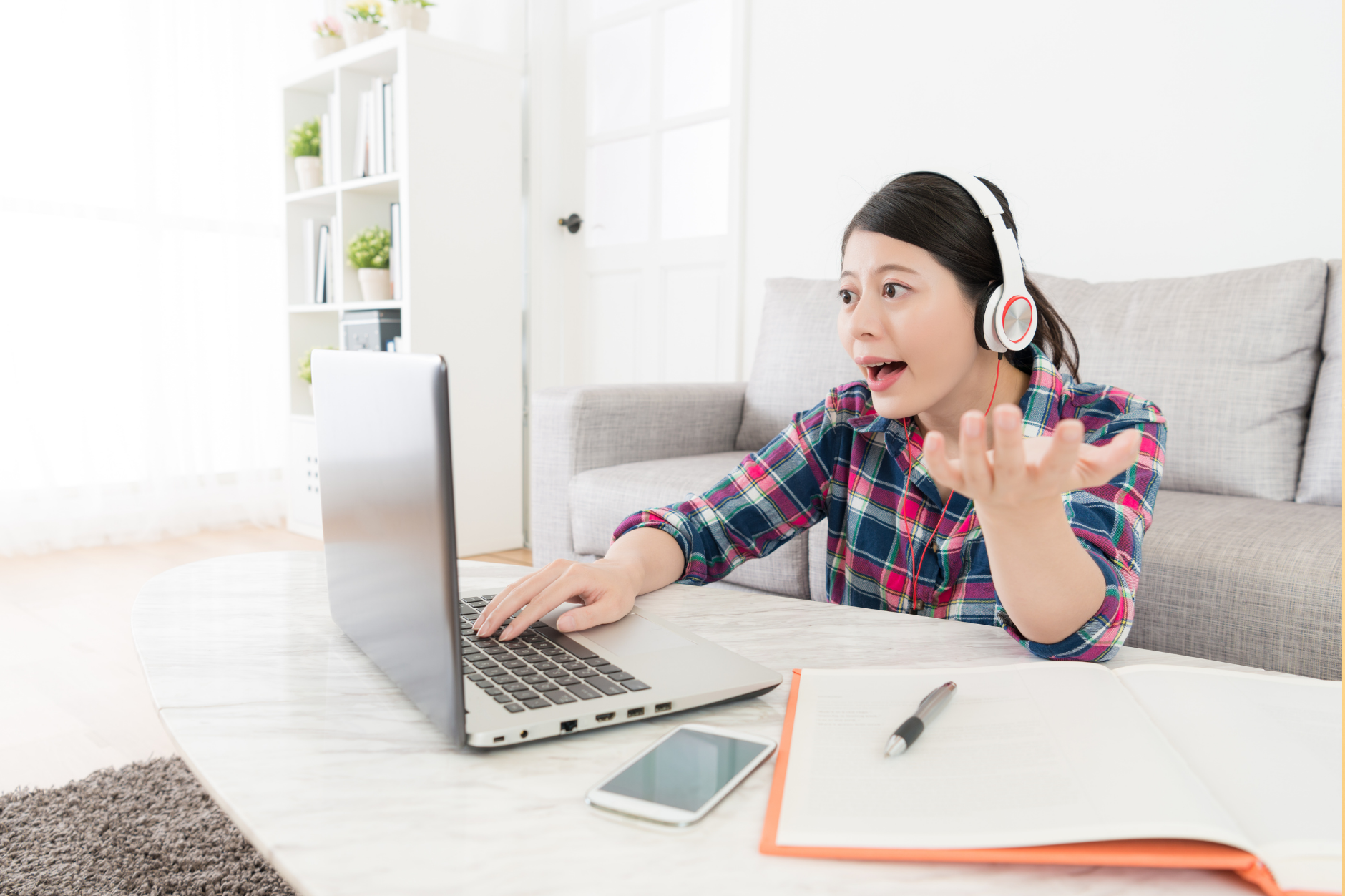 A young woman speaking on a video call