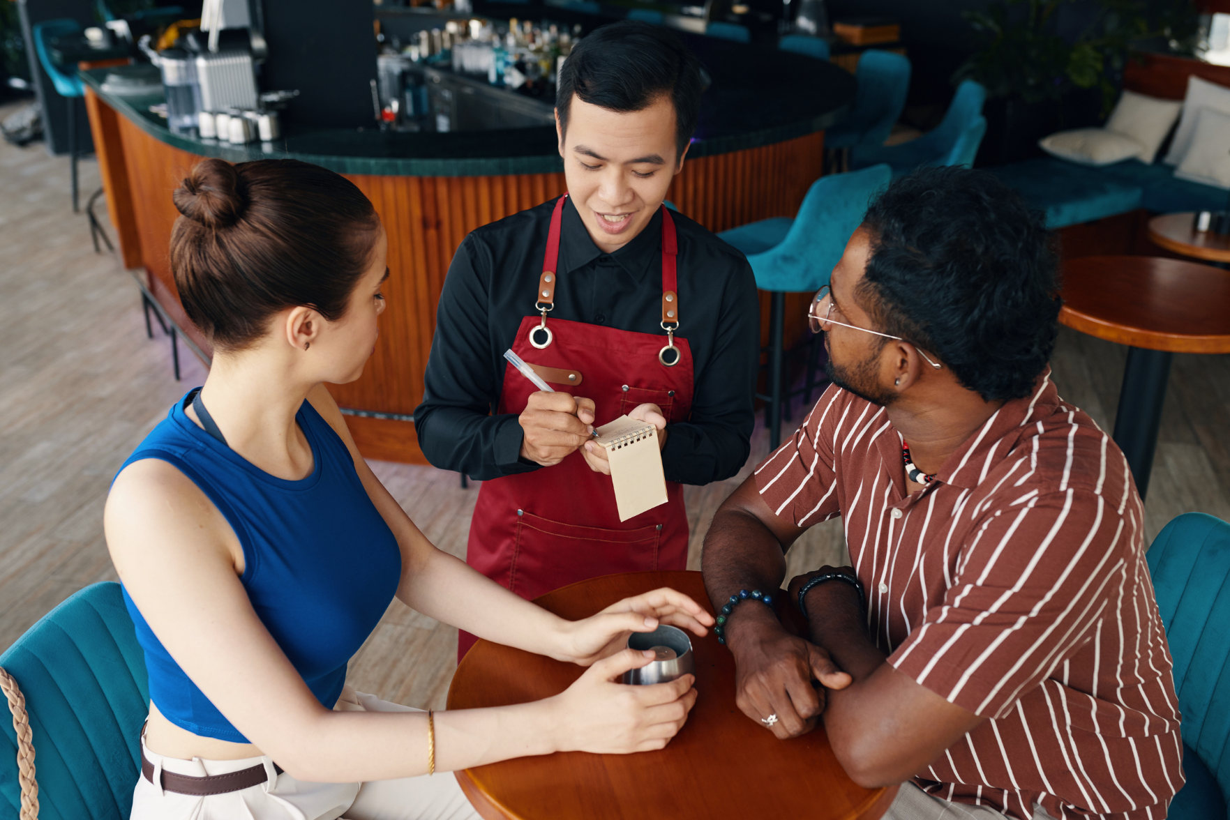 A waiter taking an order in a restaurant