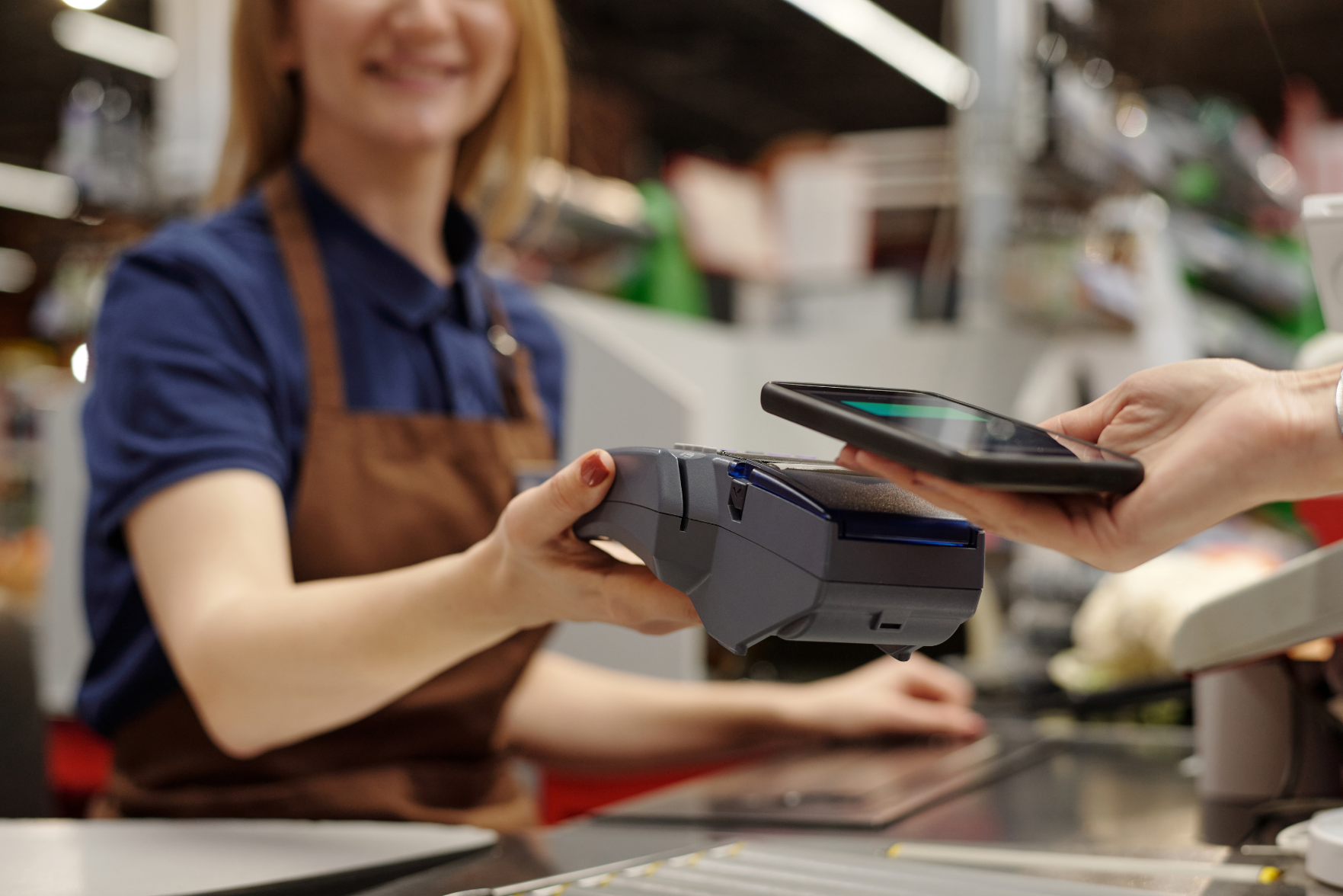 A cashier taking a payment