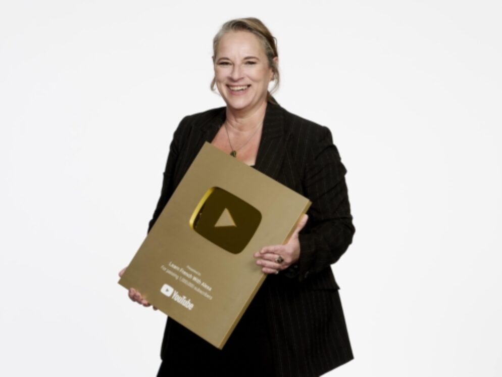 Alexa holding YouTube hold plaque