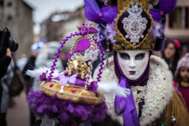 Person in purple costume and mask