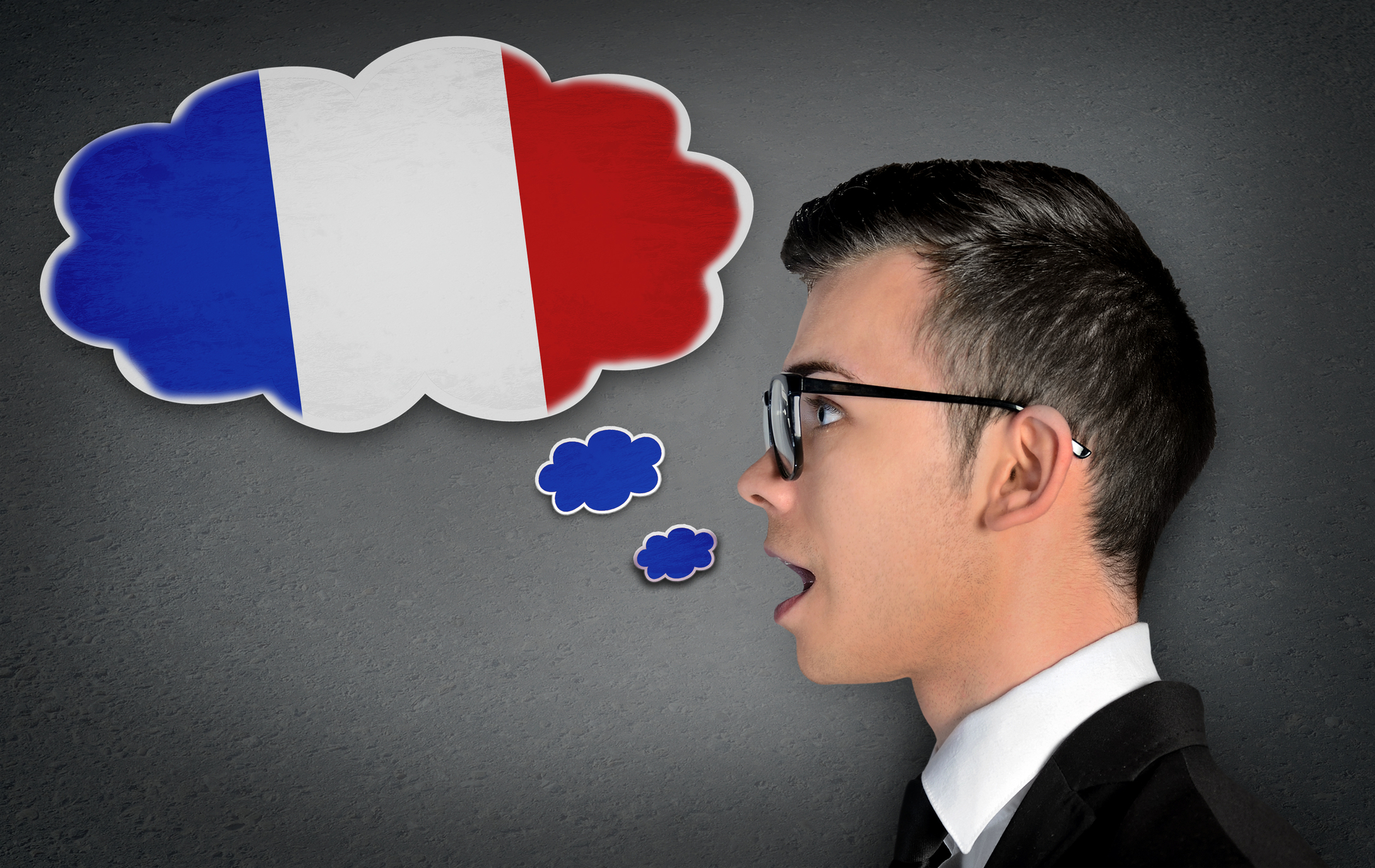 A speech bubble containing a French flag issuing from a man's mouth
