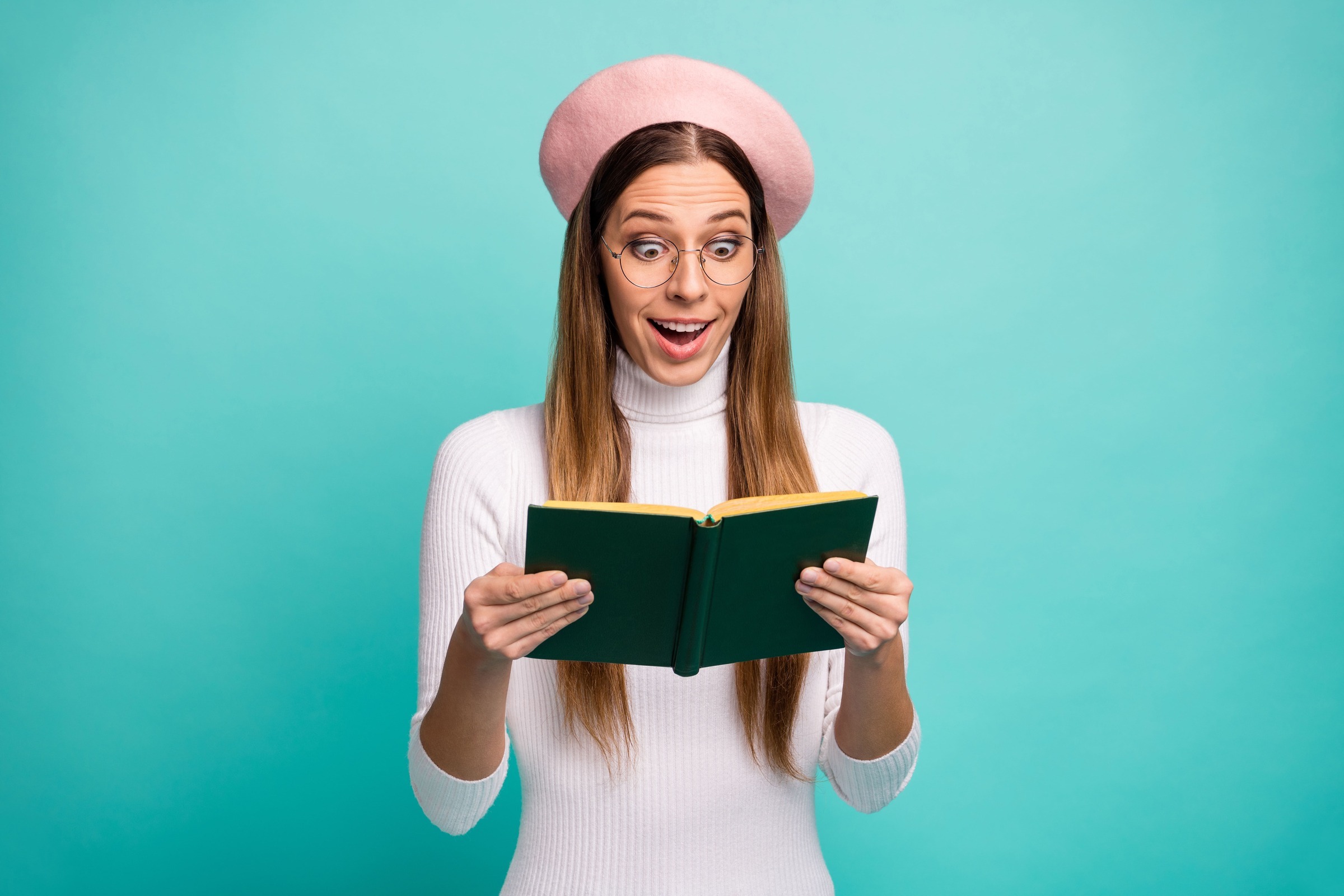 Woman in a beret reading a book